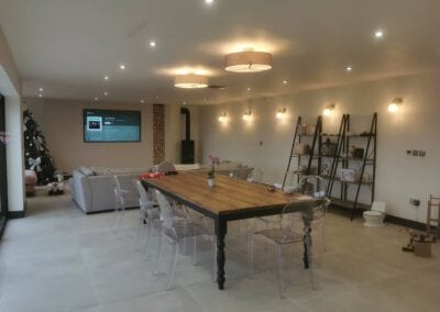 Open plan dining and living area lighting installation by professional electrician in Wigan